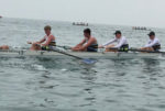 Ryde junior coastal four rowers on the water
