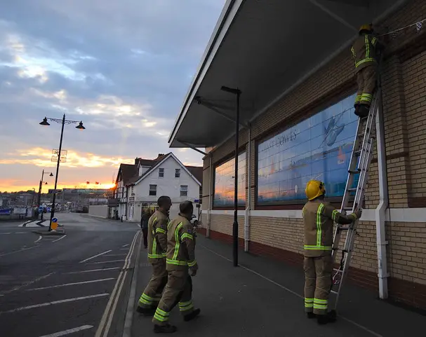 Bunting being put up by firemen