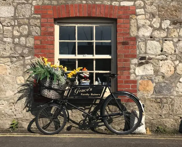 Bicycle with flowers outside Grace's Bakery