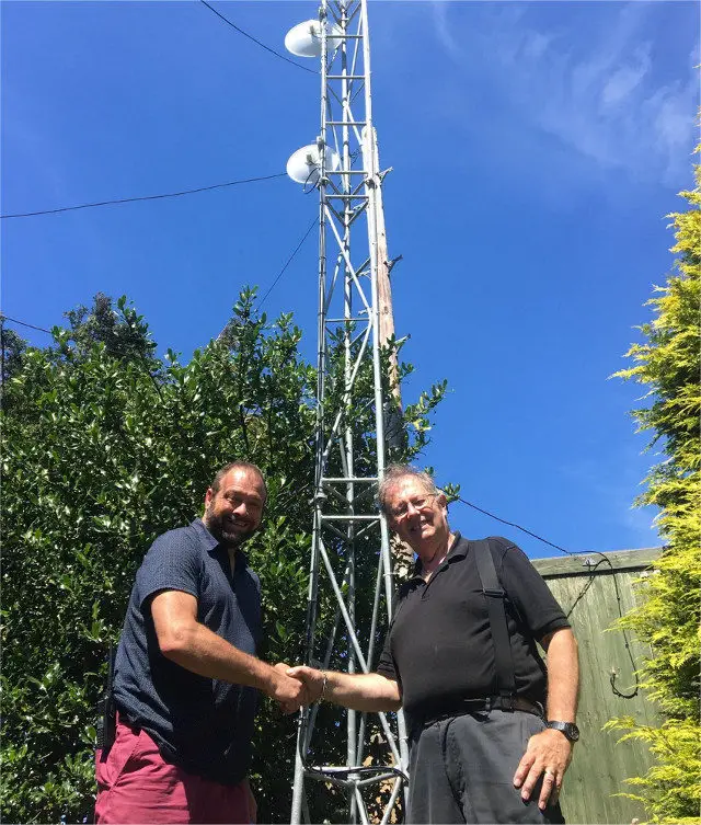 Picture Image: Dean Terrett, of Isle of Wight Search and Rescue (left) with Kelvin Currie, of Vectis Radio, at the transmitter mast near Newport