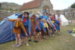 girl guides at carisbrooke outside their tent