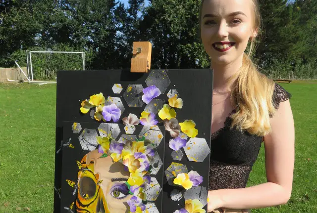 Jessica Wiles priory school with her artwork that gained her an A star