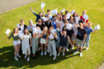Ryde School pupils holding up their GCSE Results