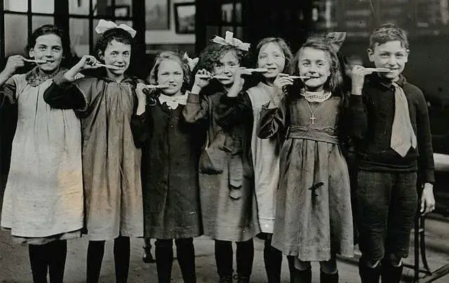 Tooth-brush drill at school, England; children pose