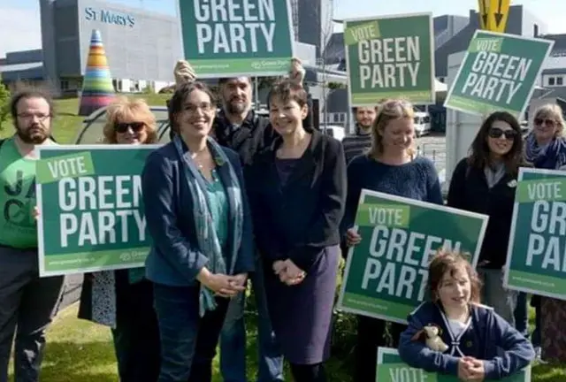 green party members and placards