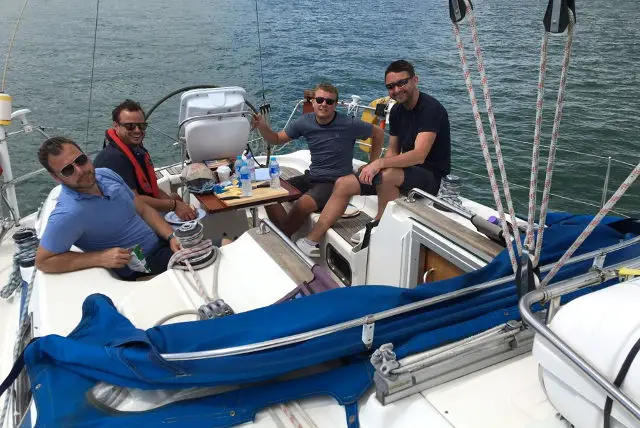 four men in a yacht