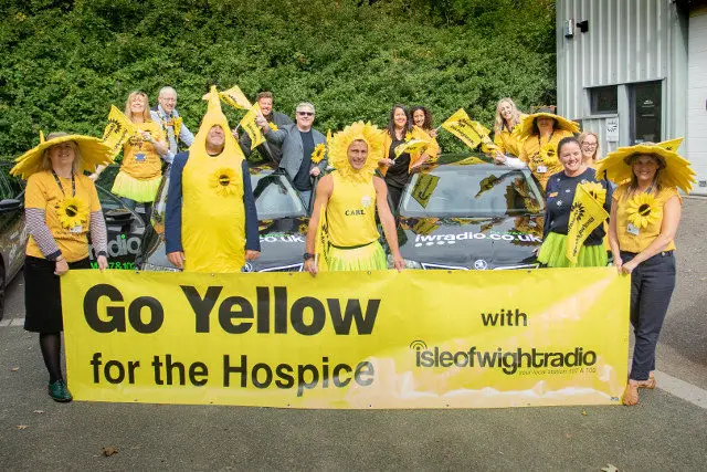 Isle of Wight Radio staff dressed in yellow