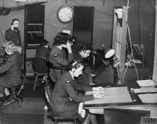 ROYAL AIR FORCE RADAR, 1939-1945. (C 1868) Chain Home: airmen and WAAF operators at work in the wooden Receiver hut at Ventnor CH, Isle of Wight, during the Battle of Britain
© IWM