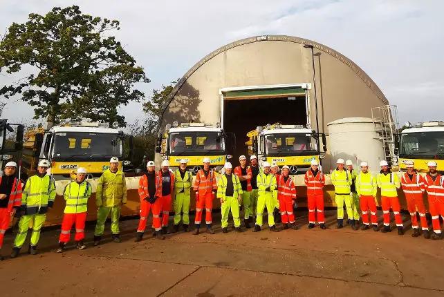 Island Roads winter team standing in front of their gritting lorries