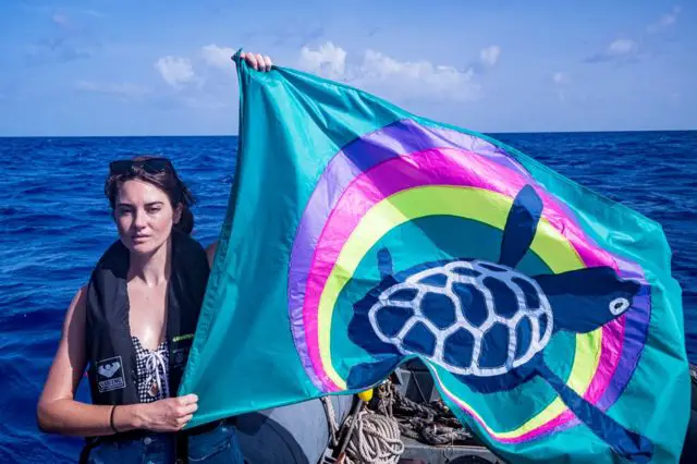 Shailene Woodley with Liz Cooke Greenpeace turtle flag