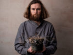 Rob Auton holding a dead plant