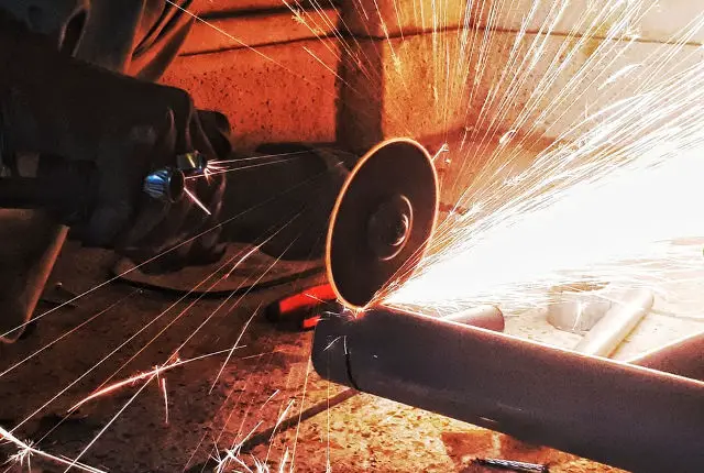 angle grinder being used with sparks flying
