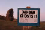 'danger ghosts' sign at Mottistone Long Stone Site