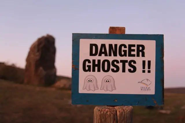 'danger ghosts' sign at Mottistone Long Stone Site