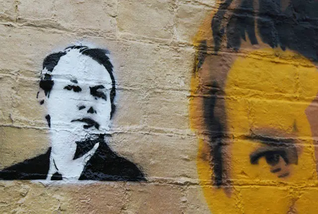 julian assange graffiti on a wall