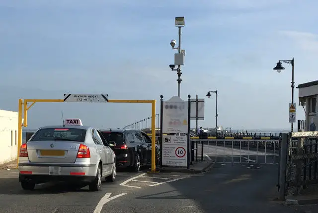 taxi driving on to the pier