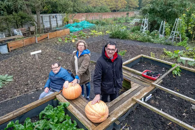 The Muddy Boots project at Quarr Abbey - three of the volunteers in the veg garden