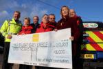 Steve Ambrose (left) and IW Foundation co-ordinator Samantha O' Rourke (right), presenting the cheque to WightSAR volunteers