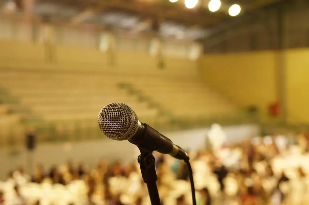 Microphone with sports hall in background