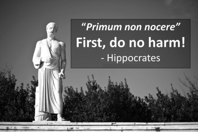Statue of Hippocrates with quote 'first do no harm'