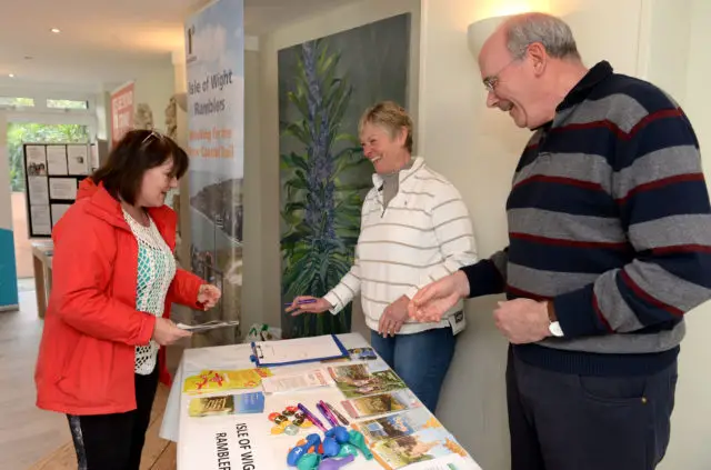 Ventnor Botanic Garden. Volunteer Fair. From left, visitor Carolyn Lymn volunteering for the Ramblers with membership secretary Jacky Carter and chairman Mike Slater.