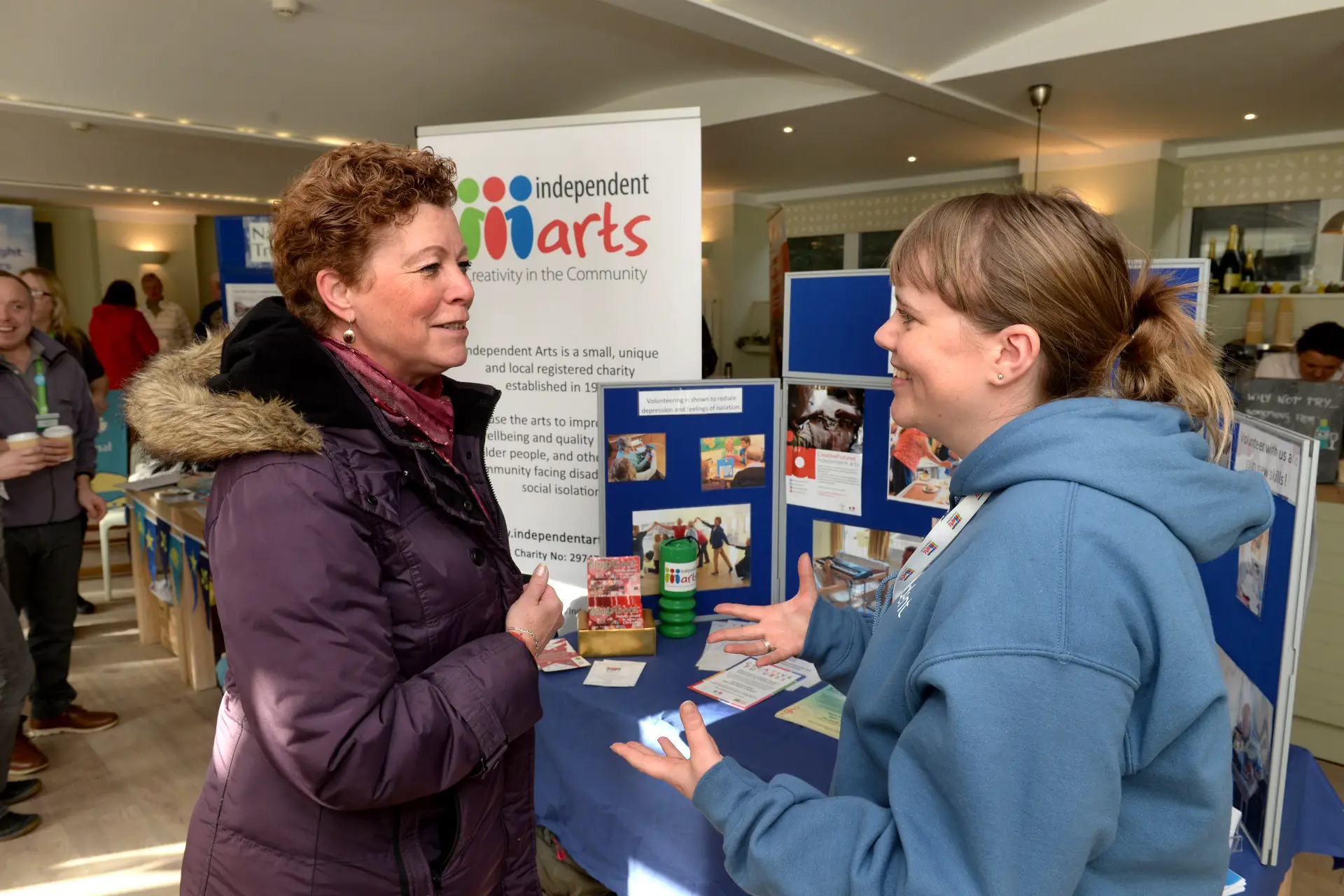 Visitor Elaine Harris, left, talking to Independent Arts project manager Hannah Griffiths.