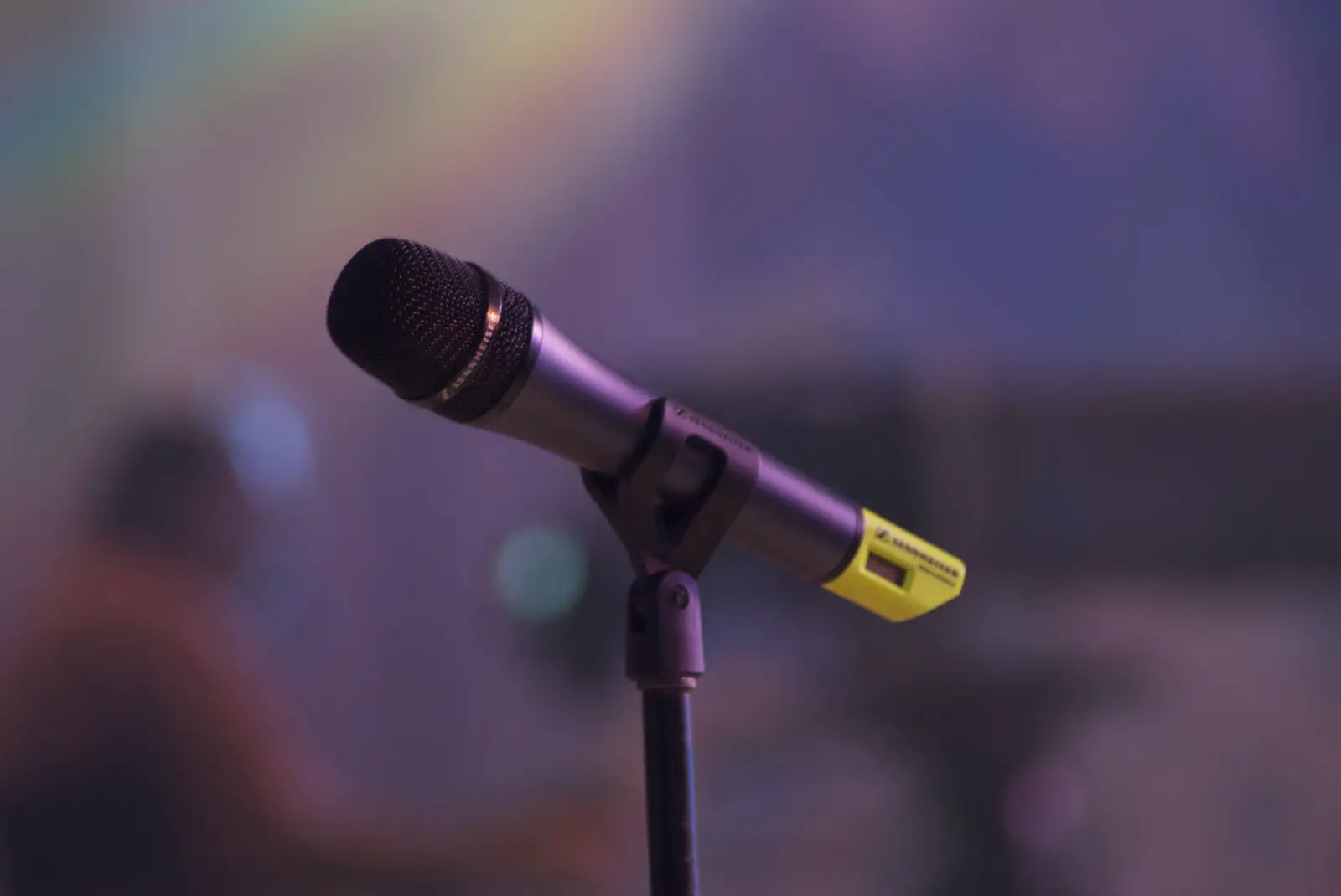 microphone with person sitting in the background