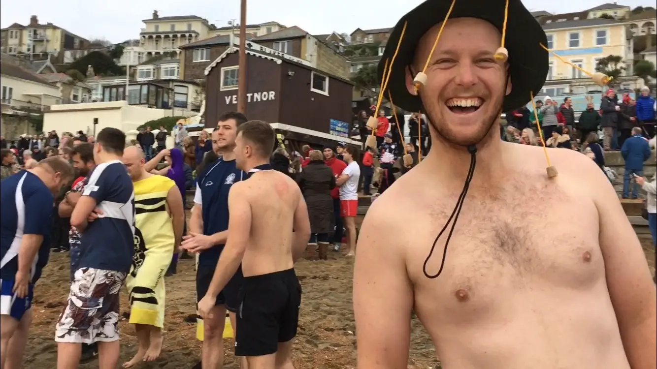 Bare topped man taking part in boxing day swim