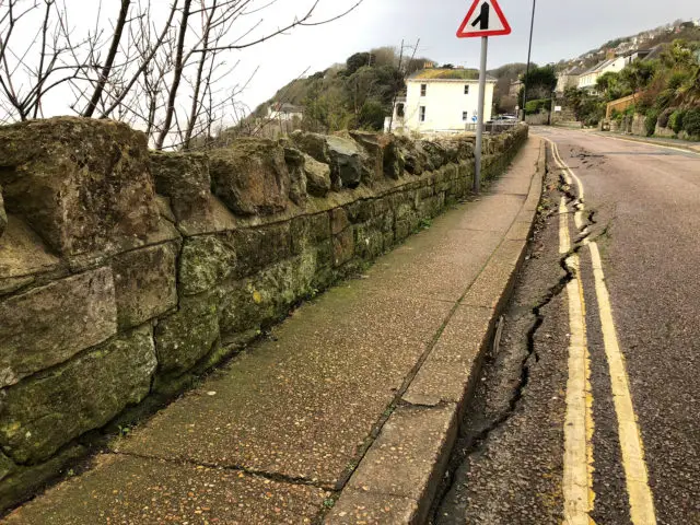 The road and footway directly above the landslide