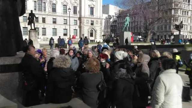 1950s-born women meet at the Millicent Fawcett statue in Parliament Square by Cathy Elobeid