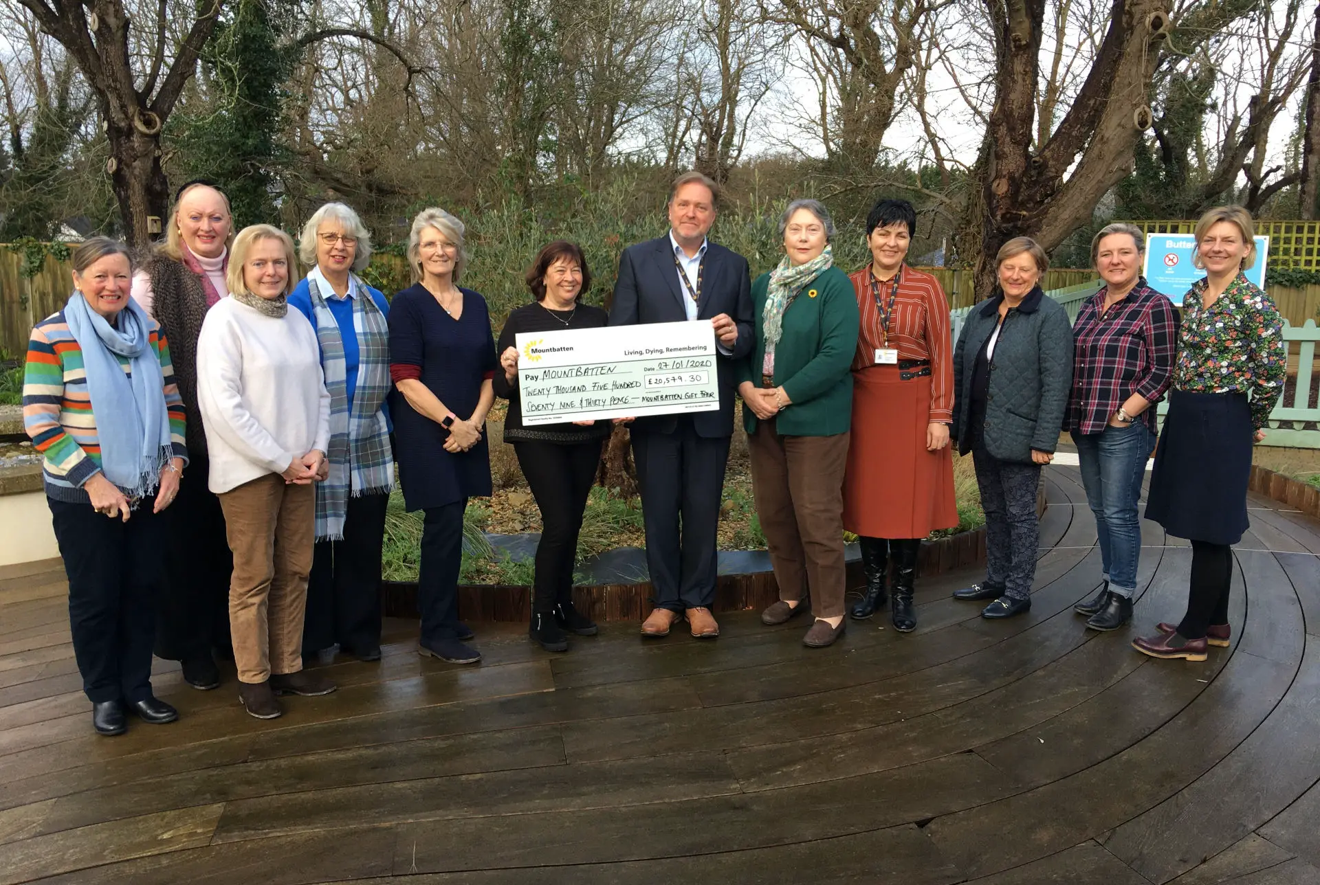 Gift Fair committee presenting cheque to Nigel Hartley