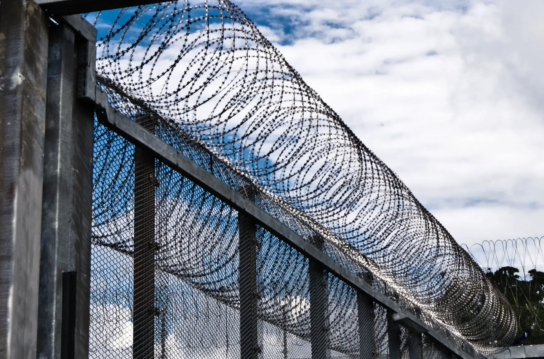 barbed wire around prison walls