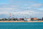 Southsea coastline with kites flying from the beach