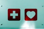 first aid and heart symbol