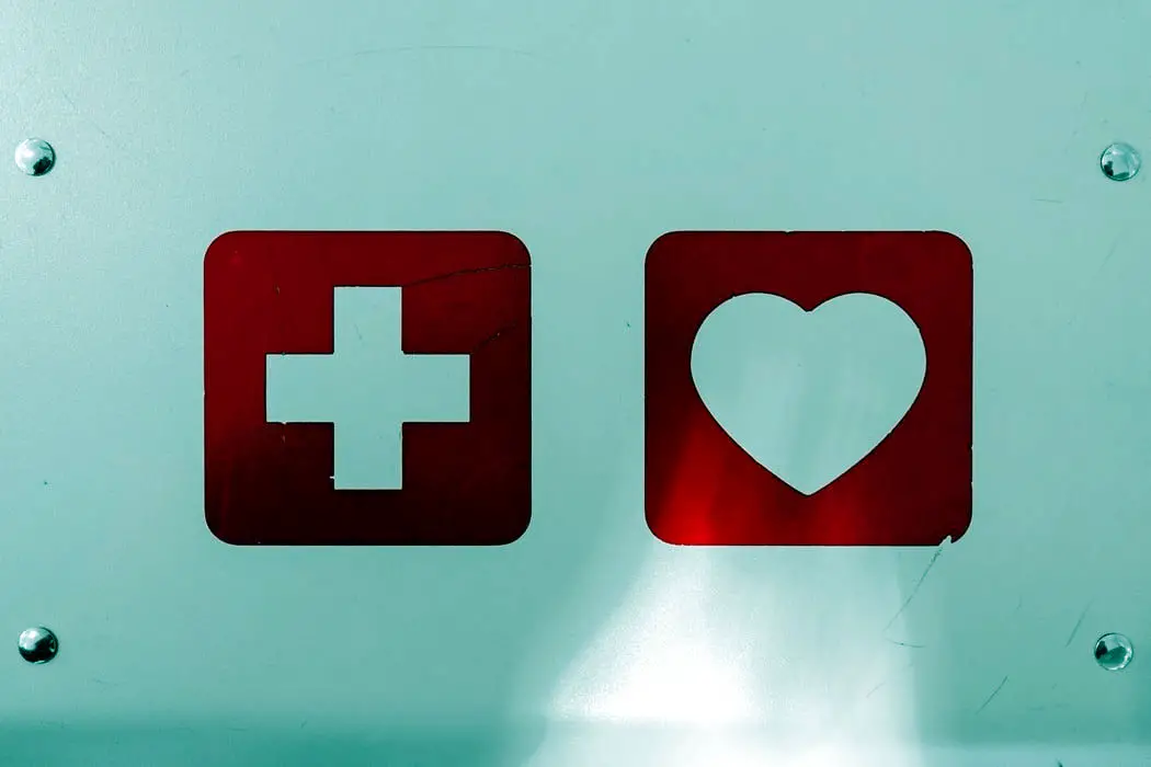 first aid and heart symbol