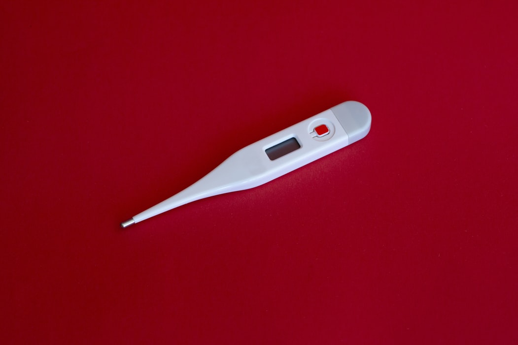 thermometer on red background