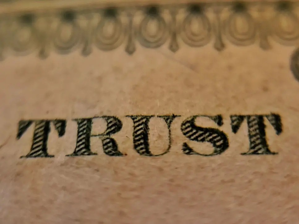 Trust typed on brown paper