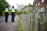 Special Constables walking down a residential street