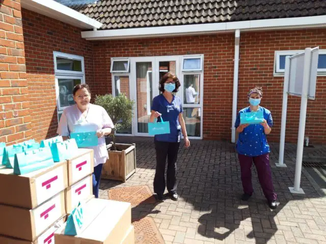 Mountbatten staff receiving the care packages from Liz Earle