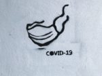 covid-19 face mask covering grafitti