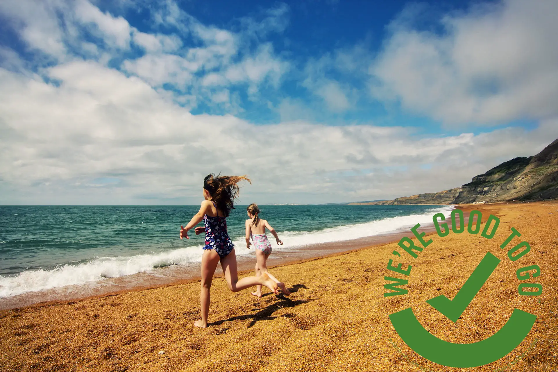 Visit Isle of Wight children on beach and good to go logo