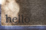 doormat with the word hello written on it