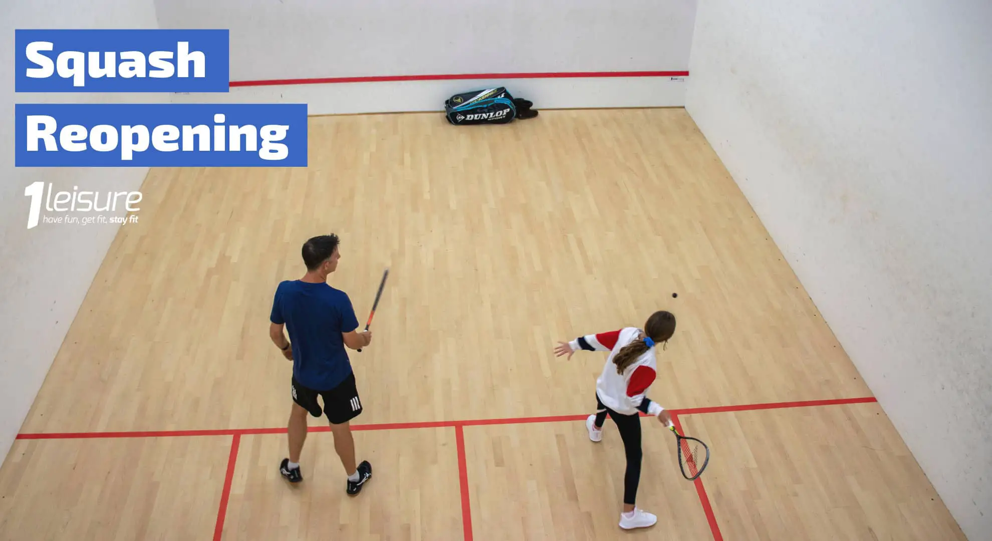 Two people playing squash at the squash court