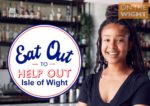 eat out to help out scheme promo with smiling woman standing by bar