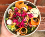 peach cafe bowl of colourful vegan food cropped
