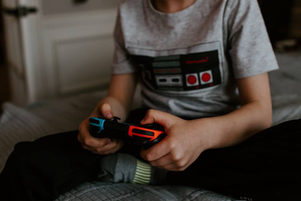 child on video game console