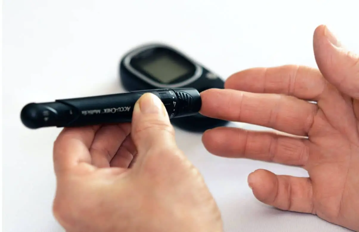 A person doing a Diabetes Check on their finger