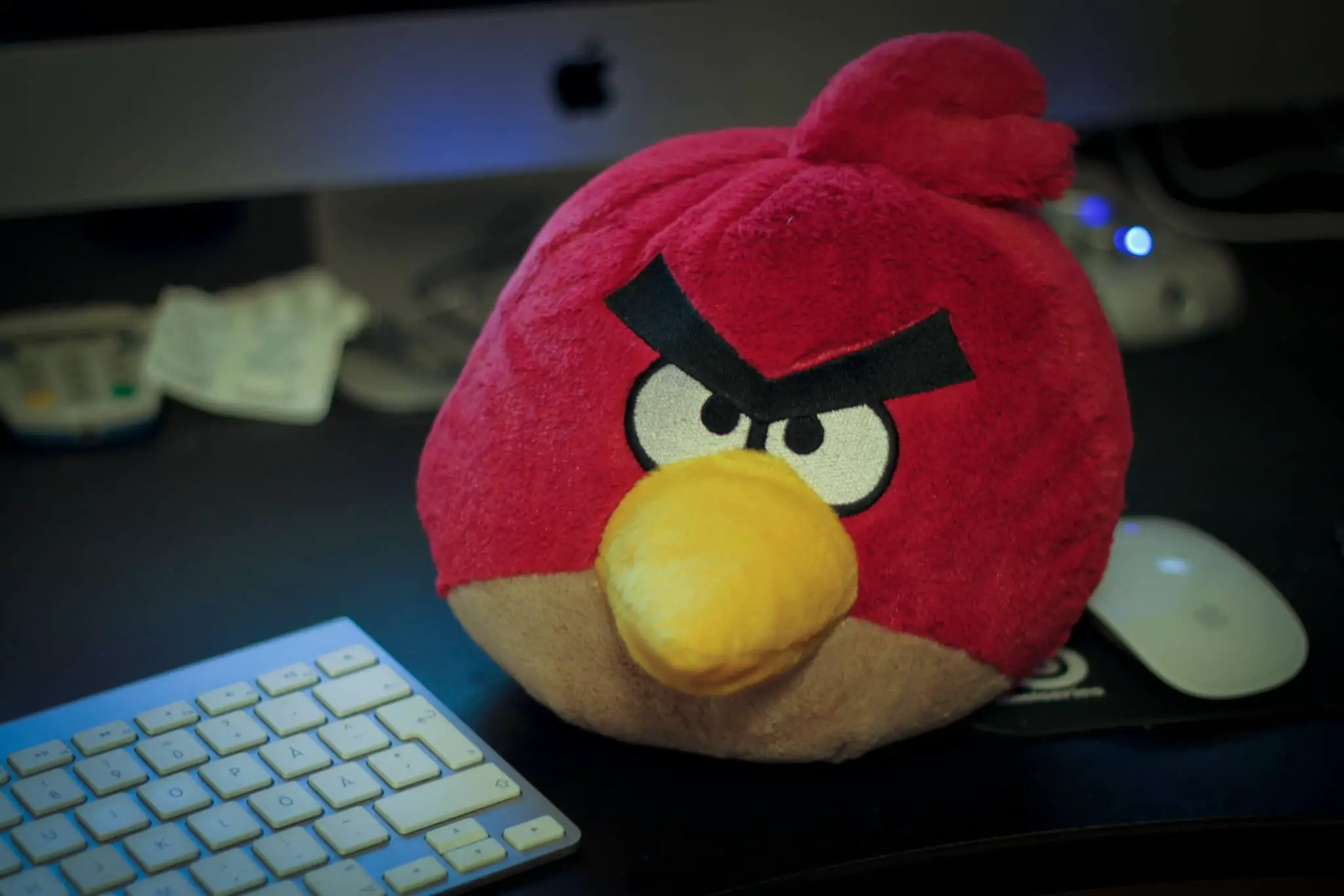 angry bird doll by computer keyboard