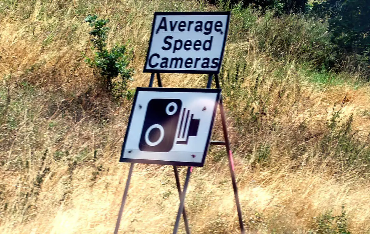 Average speed camera sign at side of road
