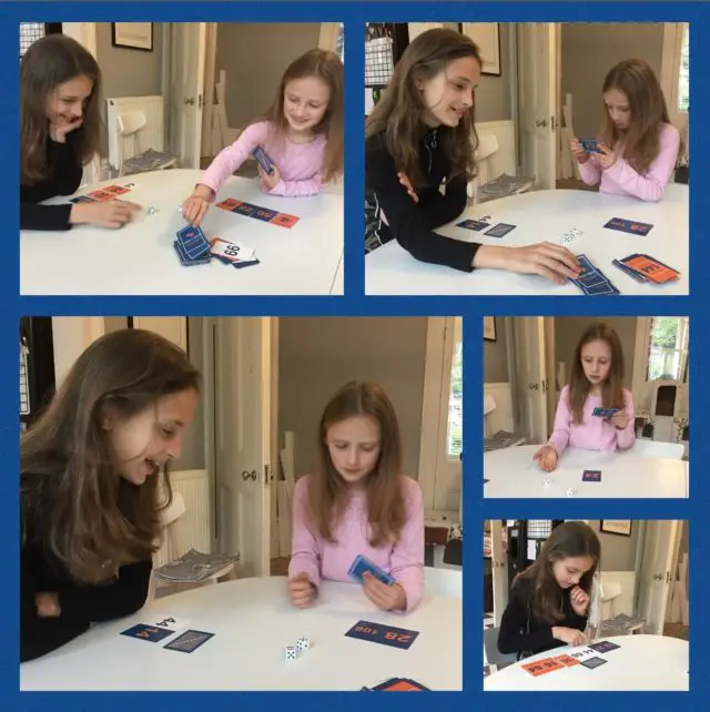 Girls playing Tablestastic card game 